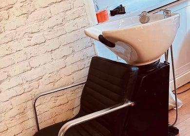 Modern salon chair and sink at Eden Aesthetic Clinic, Dublin, County Dublin, IE, perfect for stylish makeovers.