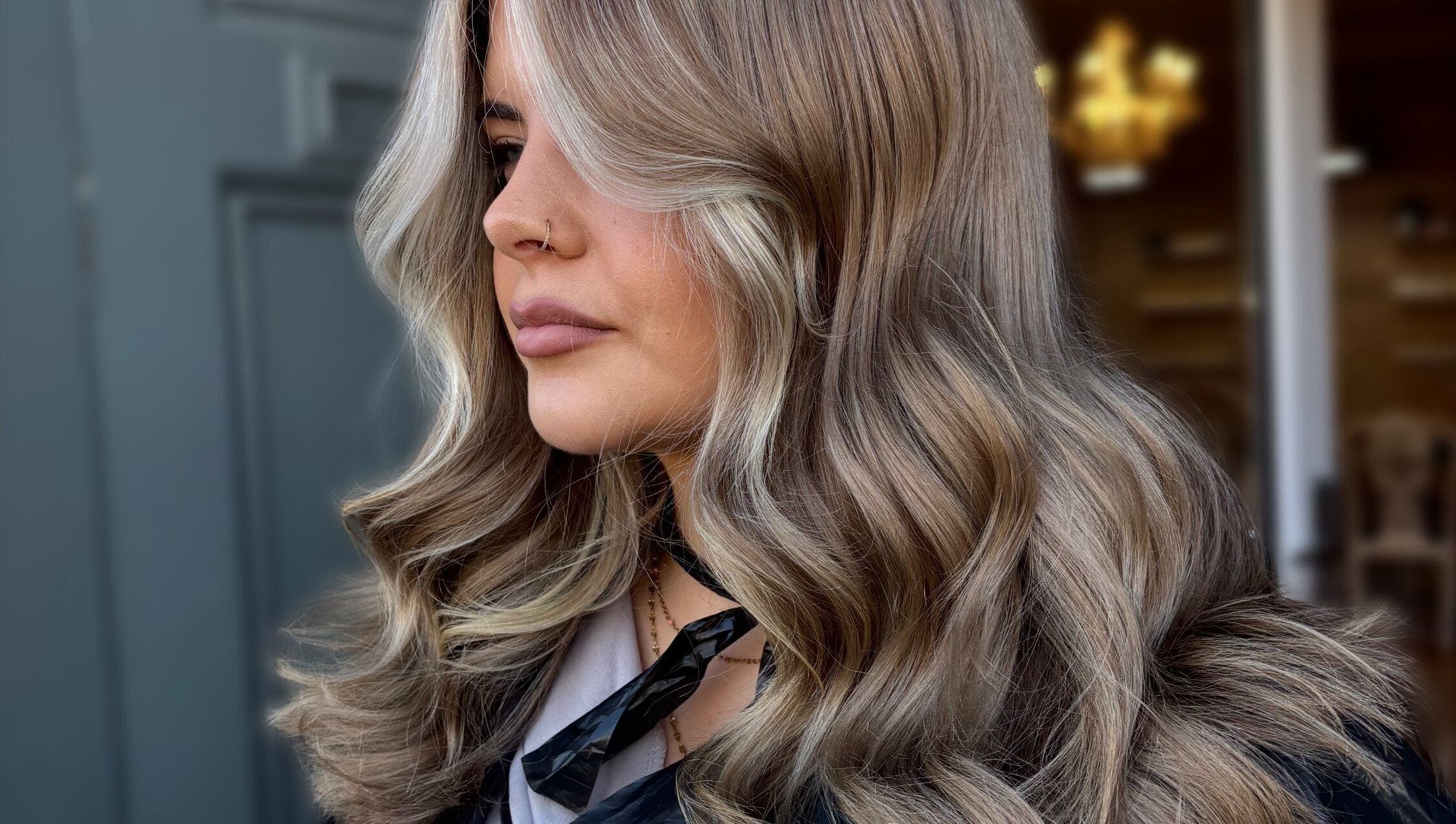 Stylish wavy blonde hair styled at Claire Sinclair Hair, Tillicoultry, Scotland, GB.