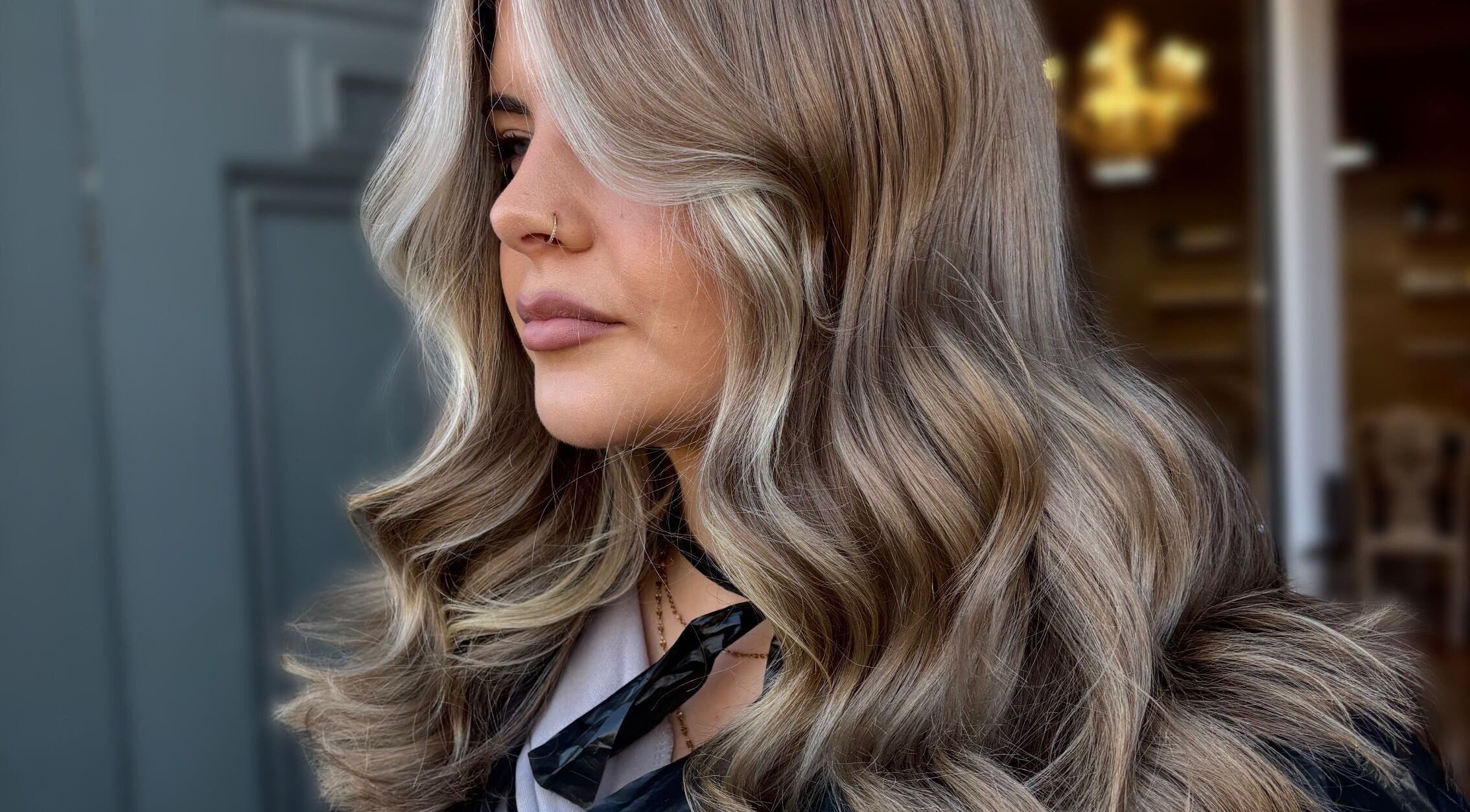 Stylish wavy blonde hair styled at Claire Sinclair Hair, Tillicoultry, Scotland, GB.