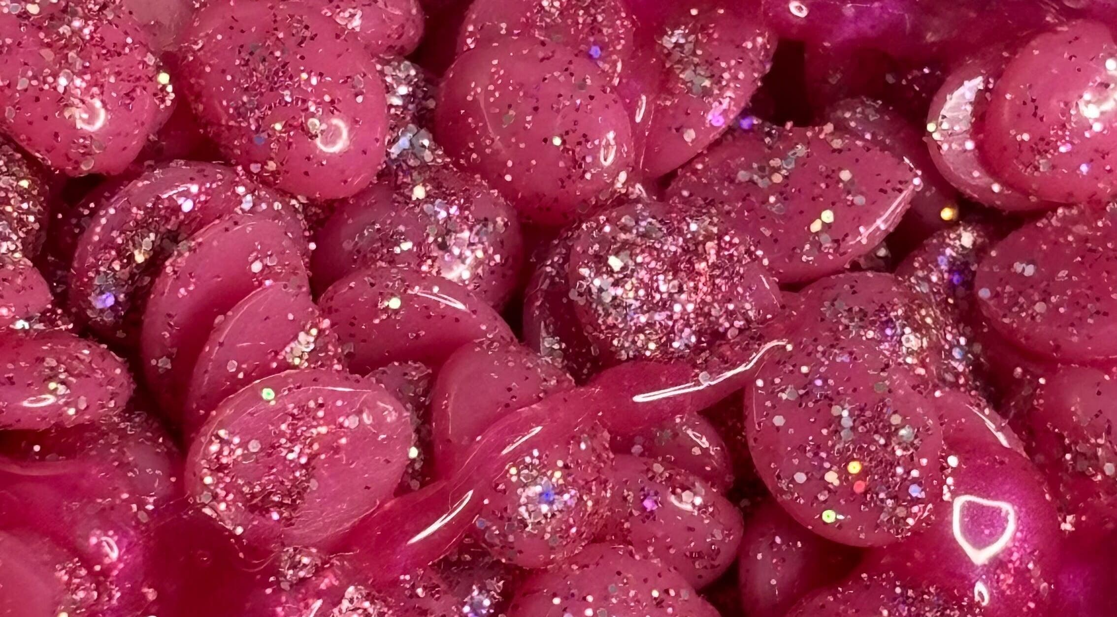 Glittery pink wax beads at My Candy Wax, River Grove, Illinois, US, ideal for waxing treatments.