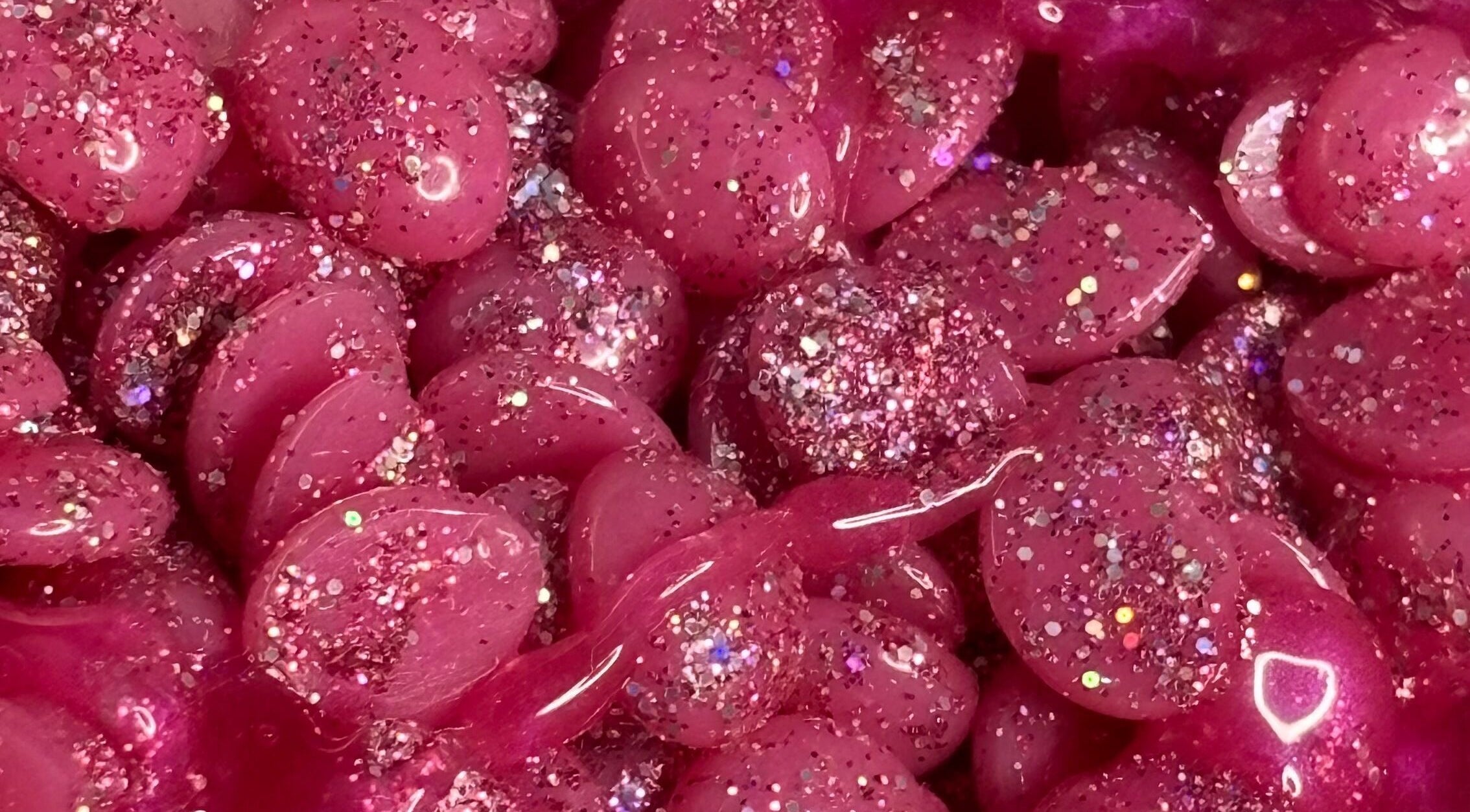 Glittery pink wax beads at My Candy Wax, River Grove, Illinois, US, ideal for waxing treatments.
