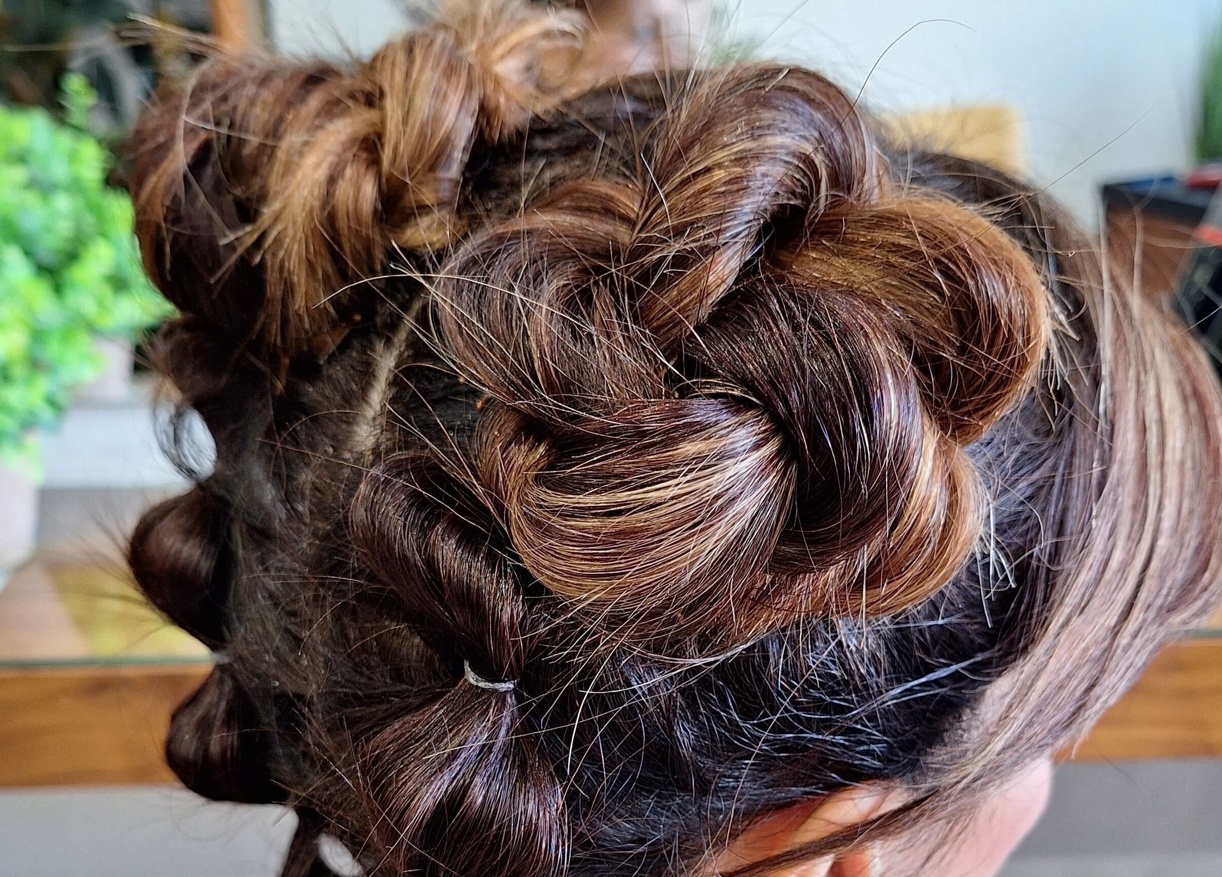 Intricate braided updo hairstyle at Xar Hair & Nails, Is-Swieqi, MT, capturing modern elegance.