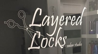 Layered Locks LLC logo at The Beauty District Salon Suites in Phoenix, Arizona, US.