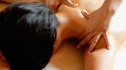 Therapist providing a soothing massage at On Cloud Nine Therapies, Godalming, England, GB.