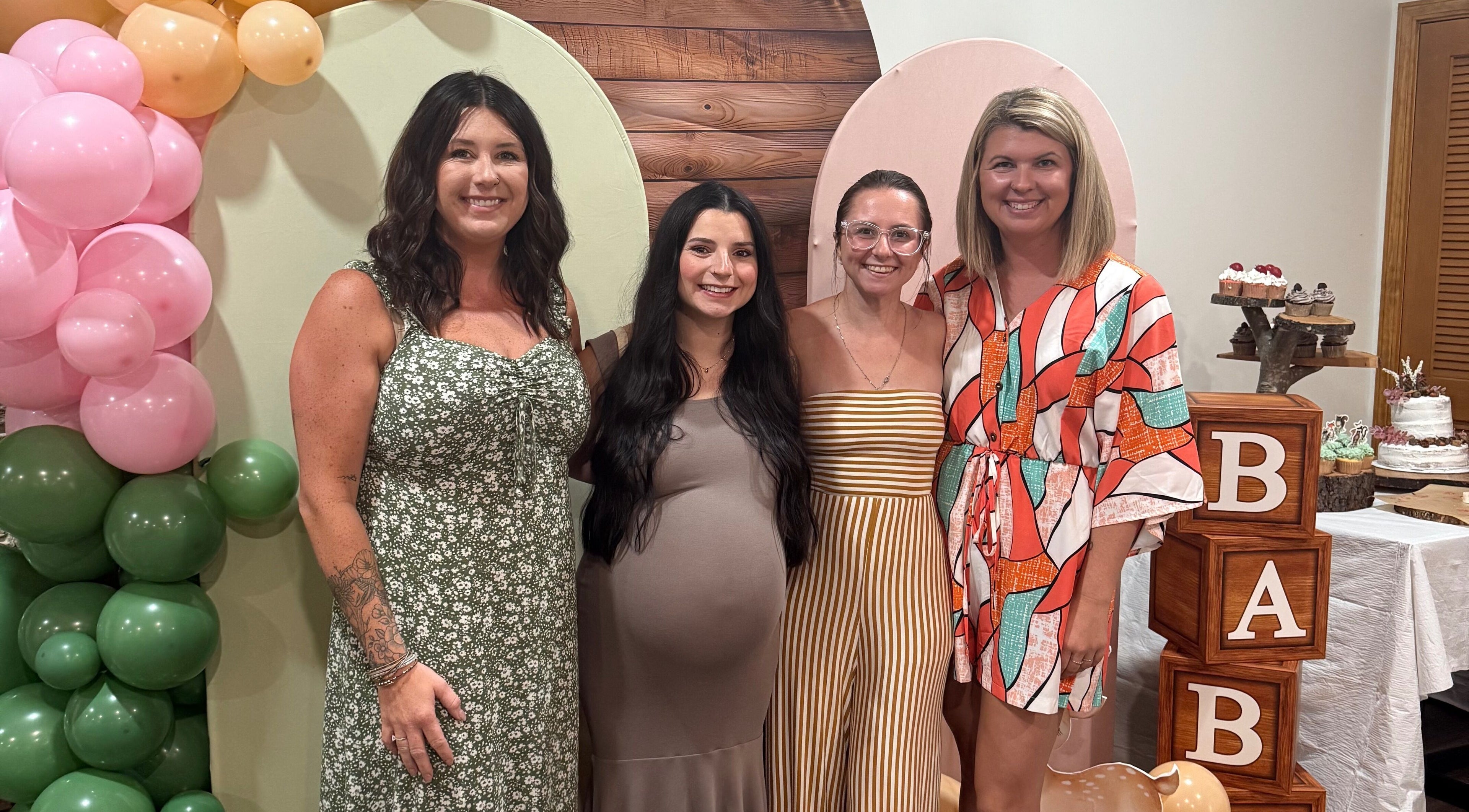 Group celebrating at The Scissor Shoppe, Worthington, Pennsylvania, US, with colorful balloons and decor.