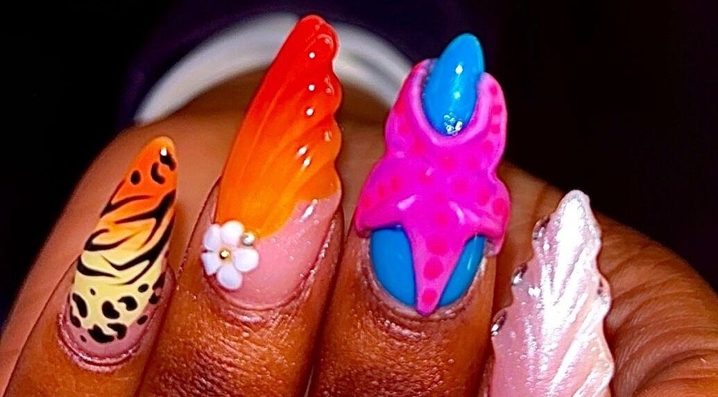Colorful nail designs at Claws With Jas in Memphis, Tennessee, US showcasing intricate patterns and vibrant colors.