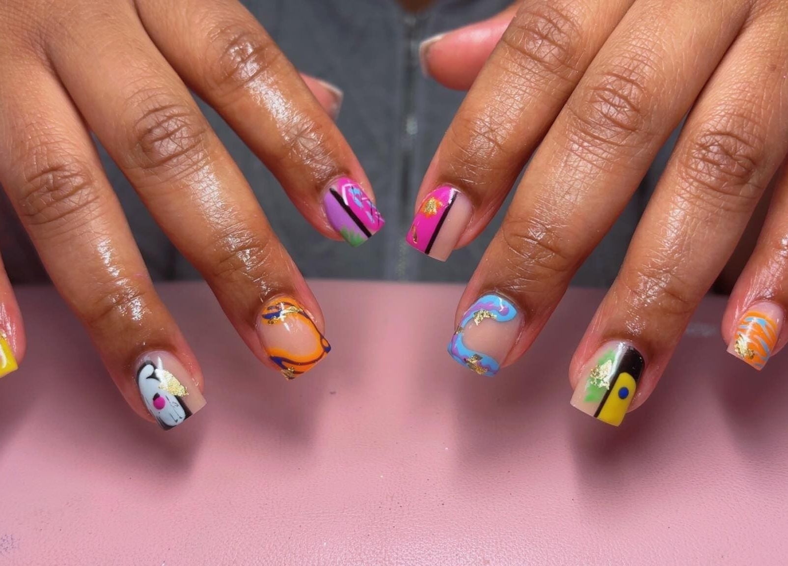 Colorful nail art at Claws With Jas, Memphis, Tennessee, US, showcasing unique and vibrant designs.