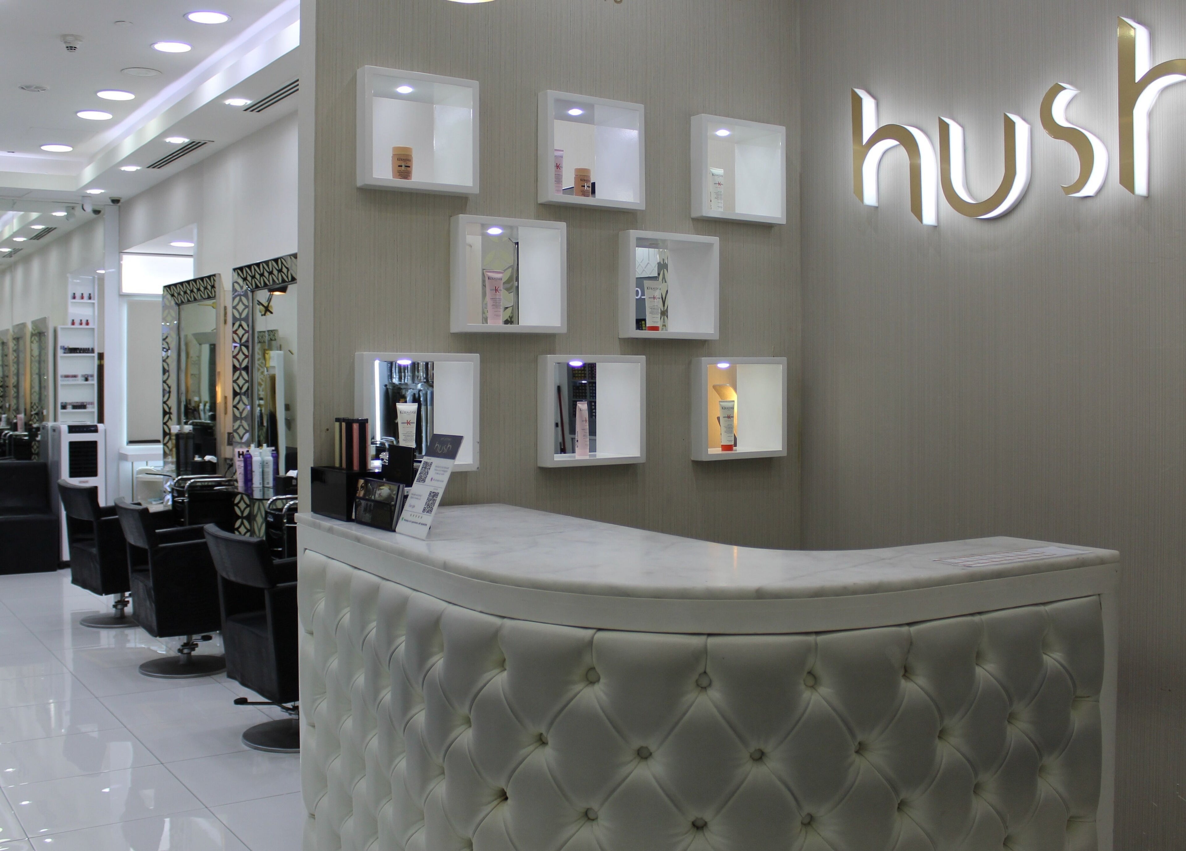 Luxurious interior of Hush Salon Kempinski Central Avenue of Dubai, featuring sleek chairs and modern design in Dubai, AE.