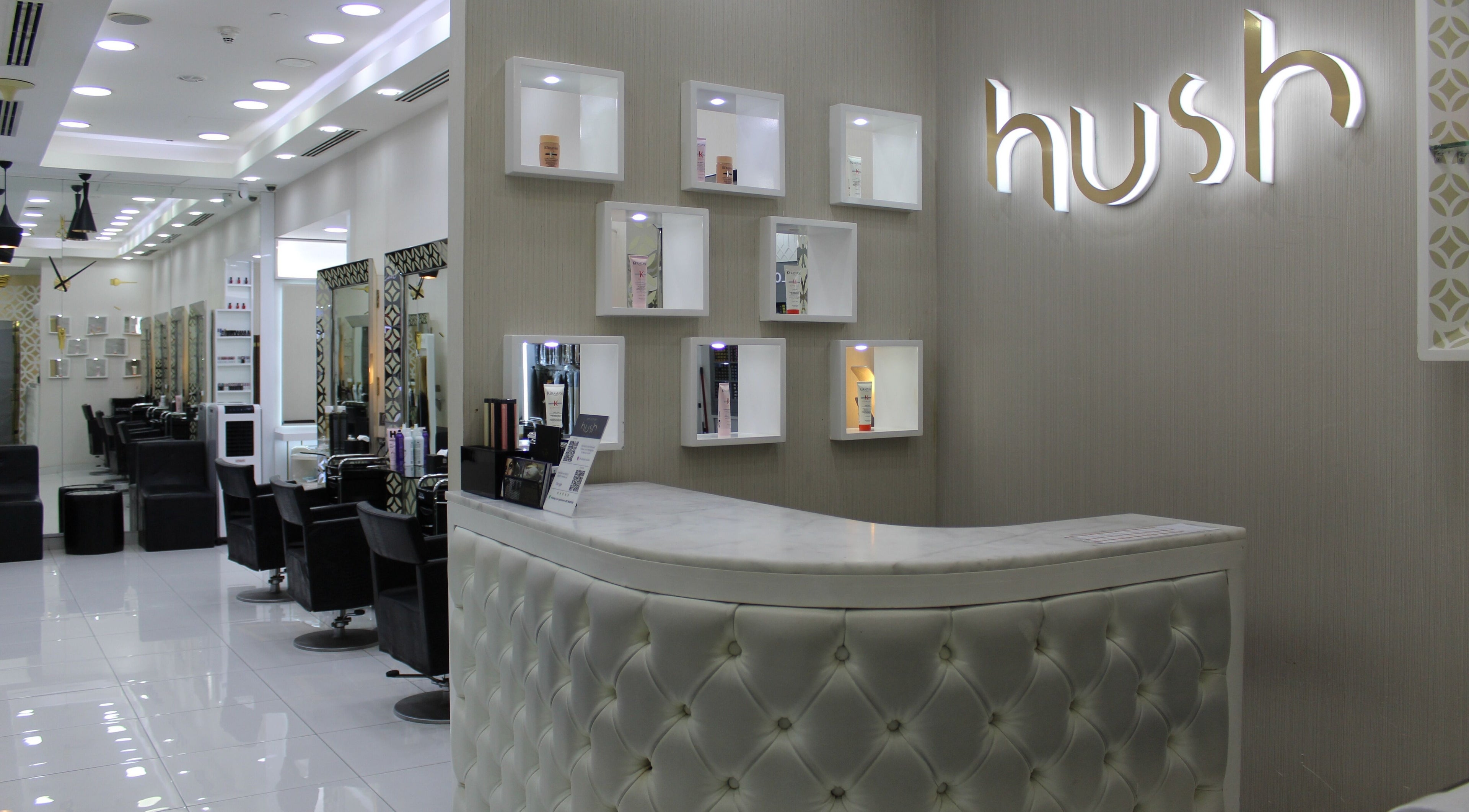 Luxurious interior of Hush Salon Kempinski Central Avenue of Dubai, featuring sleek chairs and modern design in Dubai, AE.