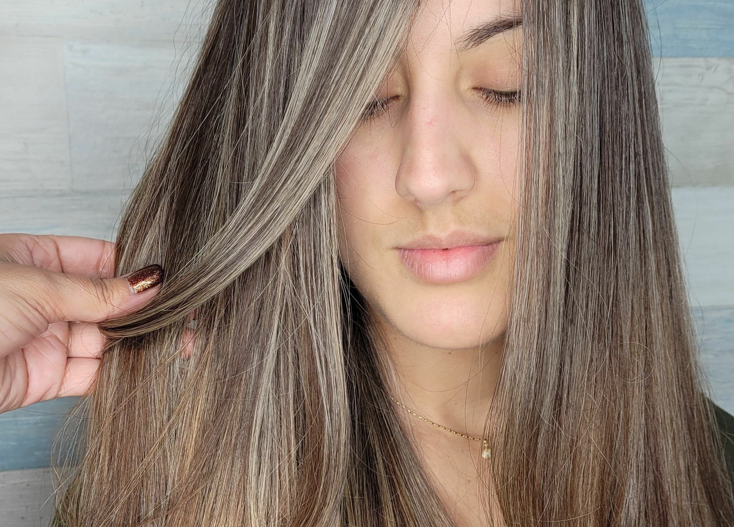 Smooth, highlighted hair styled at Gemproimage, Miami, Florida, US, showcasing premium hair care.