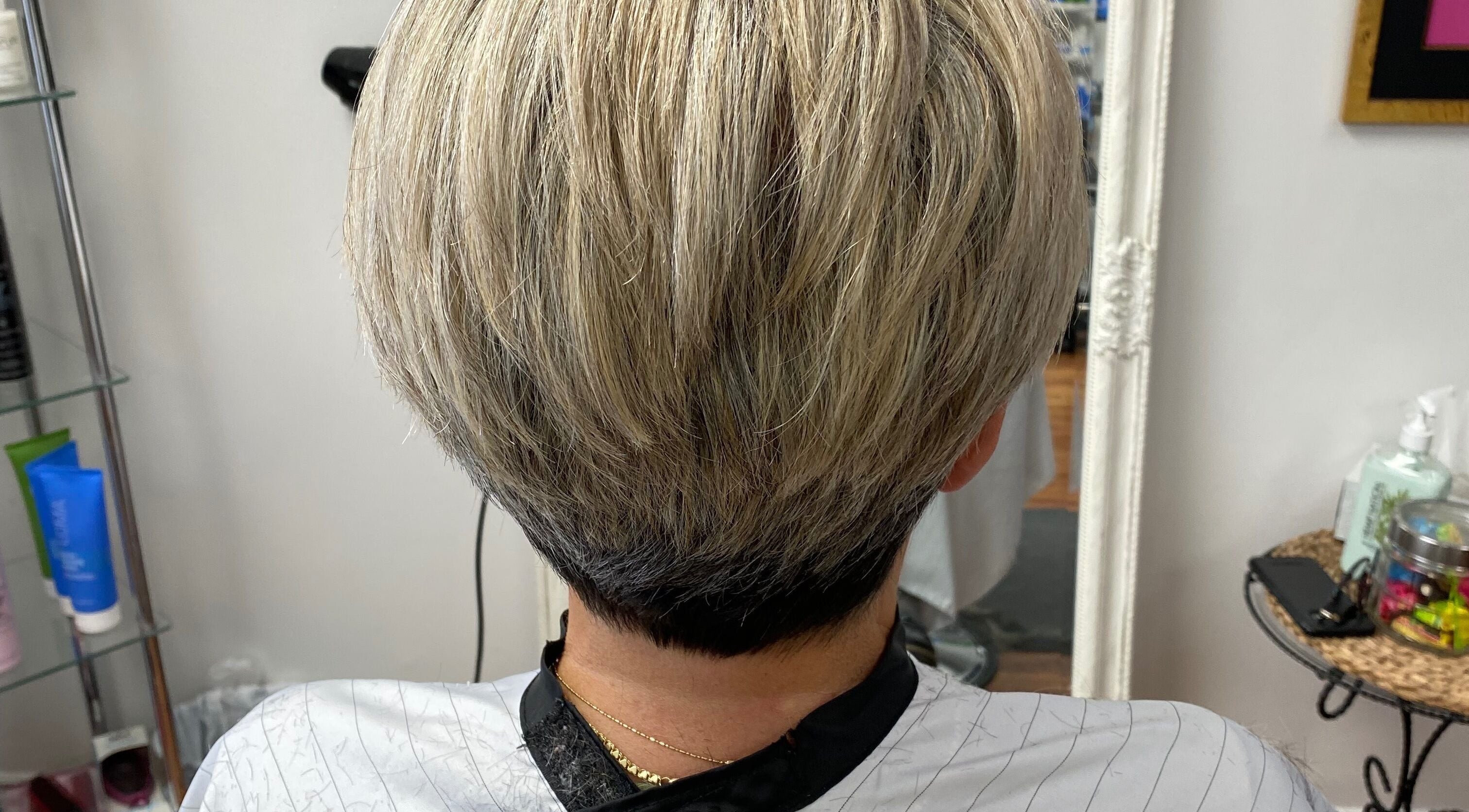 Modern blonde bob haircut at Rose Robson Hair salon in Kelowna, British Columbia, CA, showcasing sleek style.