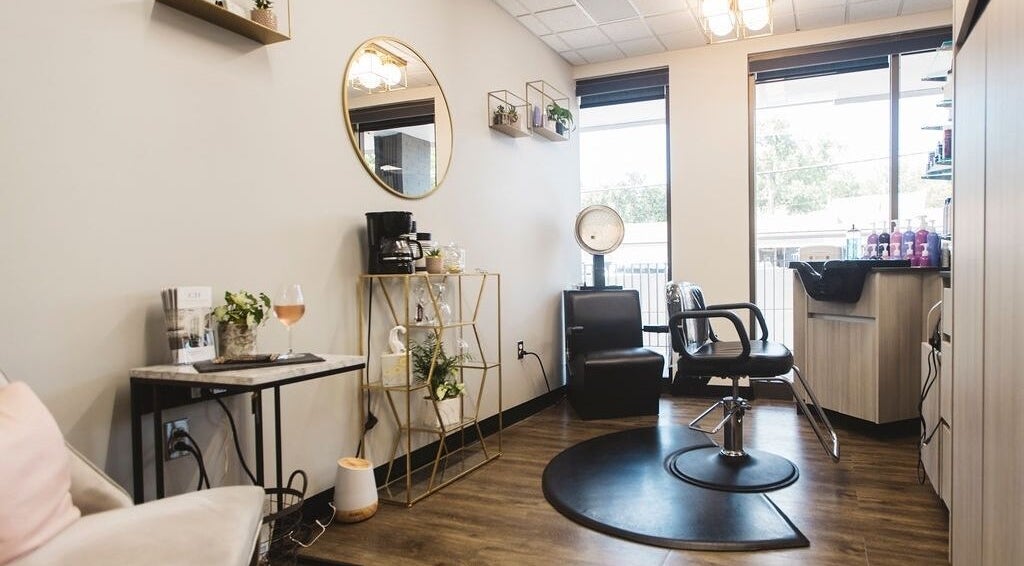 Modern salon interior at Caitlin Hair Artistry Stl in Webster Groves, Missouri, US with stylish decor.