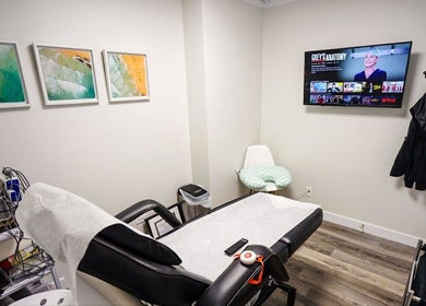 Relaxing treatment room at BodiMedic Contouring and Wellness, Edmonton, Alberta, CA with modern equipment and decor.