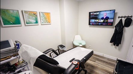 Relaxing treatment room at BodiMedic Contouring and Wellness, Edmonton, Alberta, CA with modern equipment and decor.