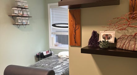 Cozy treatment room at Honey Lashes by V, Nanaimo, BC, CA showcasing soothing decor and a comfortable bed.