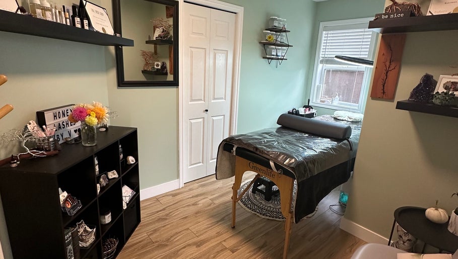 Cozy treatment room at Honey Lashes by V in Nanaimo, British Columbia, CA with elegant decor and therapy bed.
