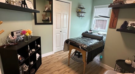 Cozy treatment room at Honey Lashes by V in Nanaimo, British Columbia, CA with elegant decor and therapy bed.
