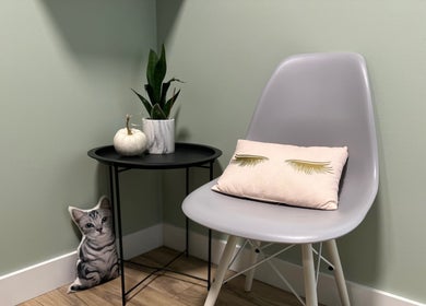 Elegant seating area at Honey Lashes by V, Nanaimo, BC, CA, featuring a sleek chair and decor.