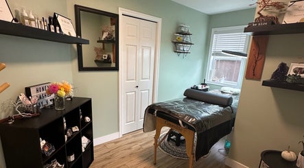 Relaxing interior view of Honey Lashes by V, Nanaimo, BC, CA with treatment table and decor.