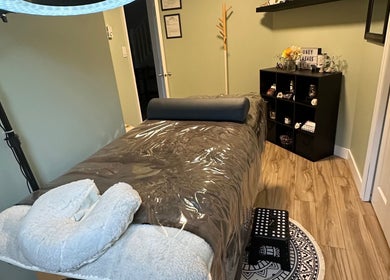 Calm treatment room at Honey Lashes by V in Nanaimo, British Columbia, CA with a plush bed and soothing decor.