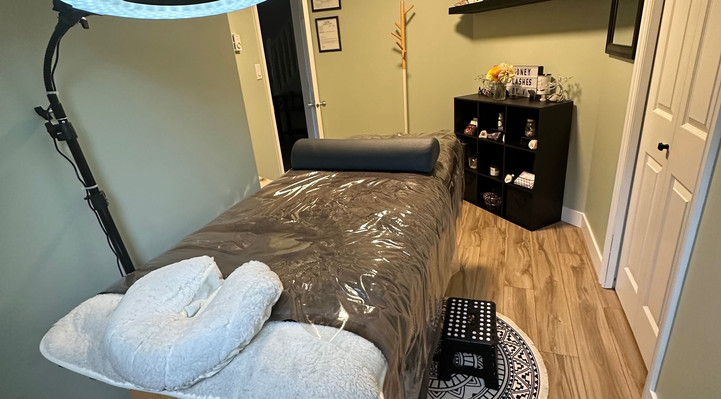 Calm treatment room at Honey Lashes by V in Nanaimo, British Columbia, CA with a plush bed and soothing decor.