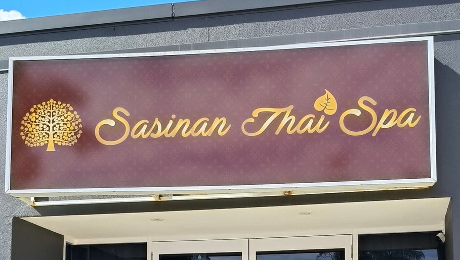Exterior sign of Sasinan Thai Spa in Sherwood, Queensland, AU featuring gold lettering.