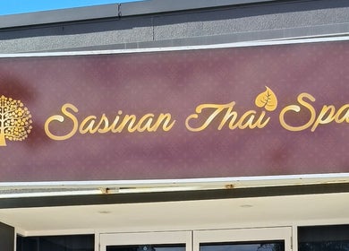 Exterior sign of Sasinan Thai Spa in Sherwood, Queensland, AU featuring gold lettering.