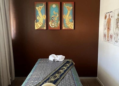 Peaceful treatment room at Sasinan Thai Spa, Sherwood, Queensland, AU with soothing decor and massage table.