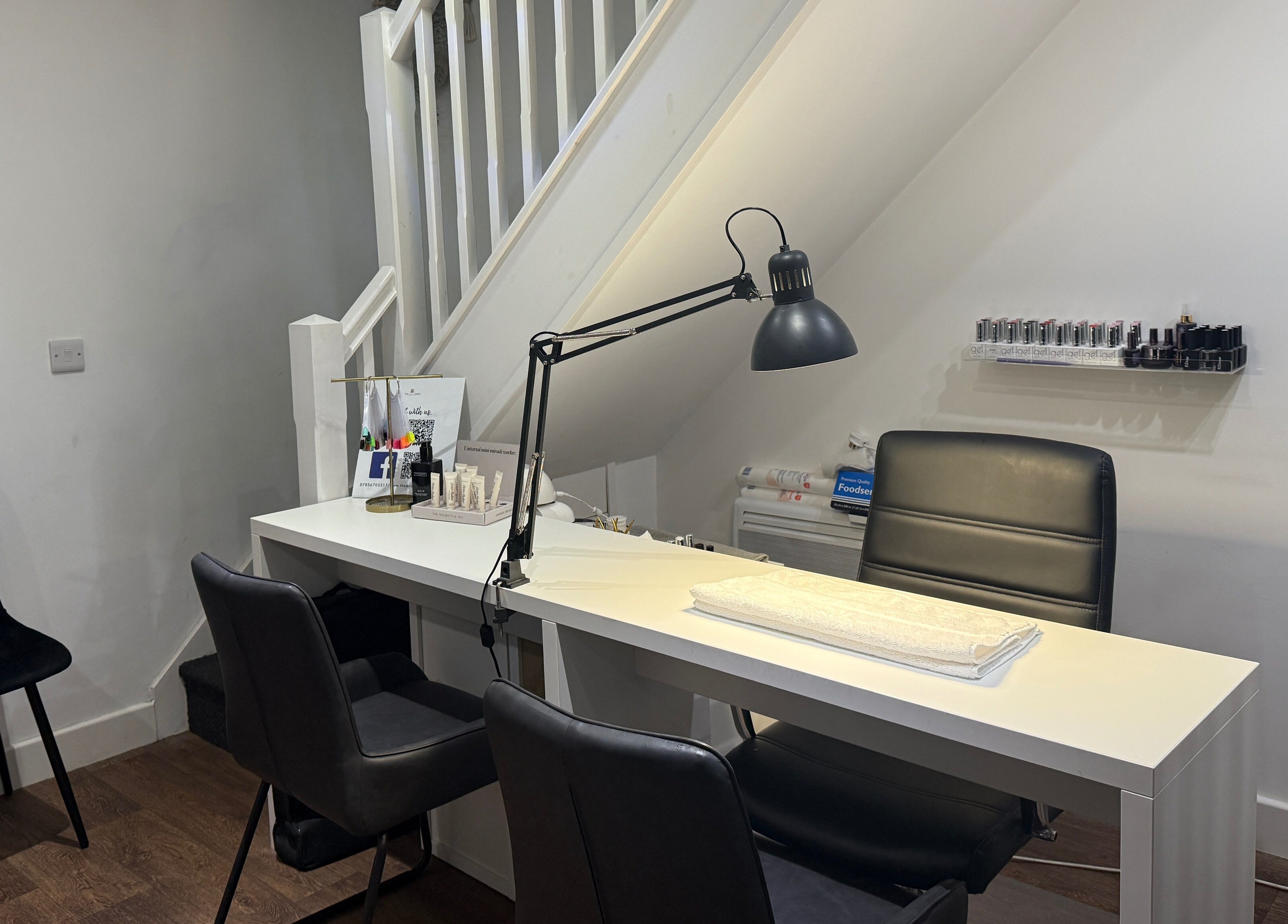 Manicure station at The Brow Barn, Middleton, England, GB, with chairs and nail tools for a relaxing treatment.