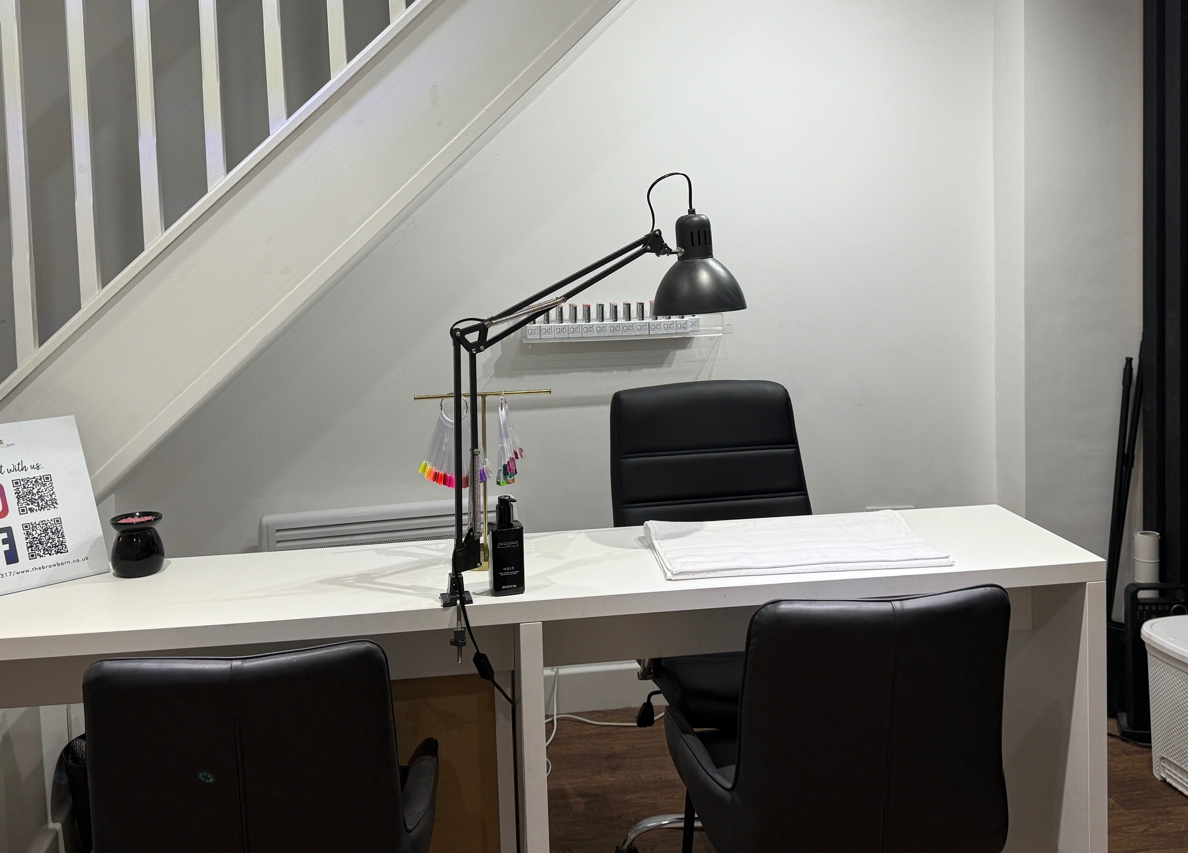 Stylish manicure station at The Brow Barn, Middleton, England, GB with chic decor and tools.