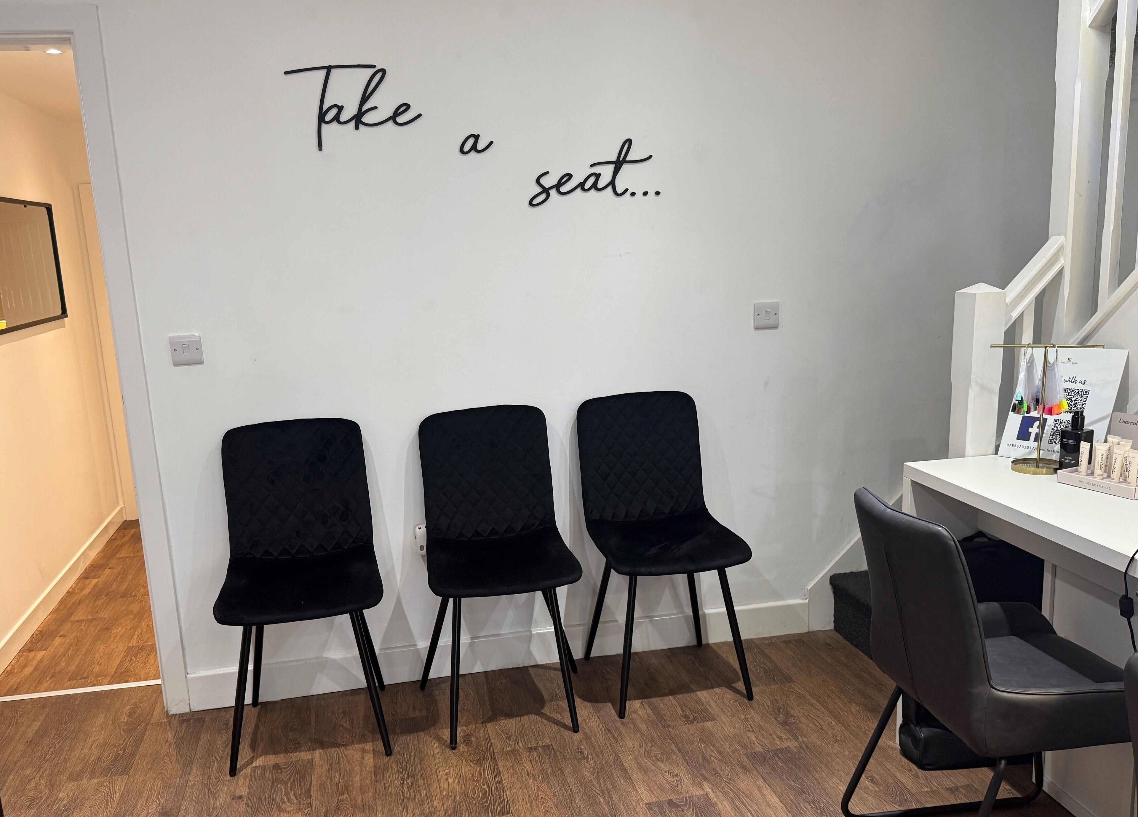 Stylish waiting area at The Brow Barn, Middleton, England, GB, with sleek chairs and modern decor.