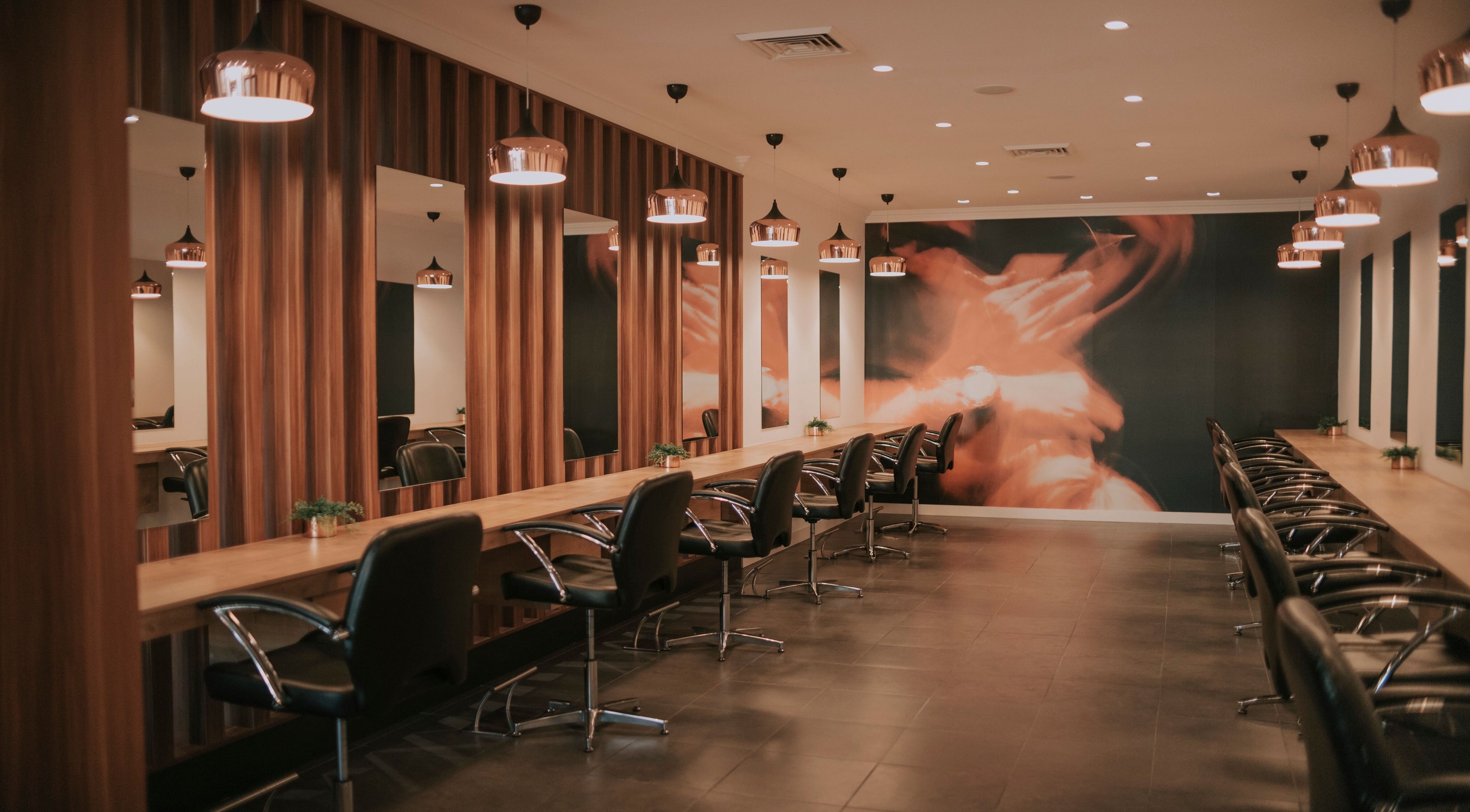 Chic interior of David Lee Hair in Perth, Western Australia, AU with stylish salon chairs and modern lighting.