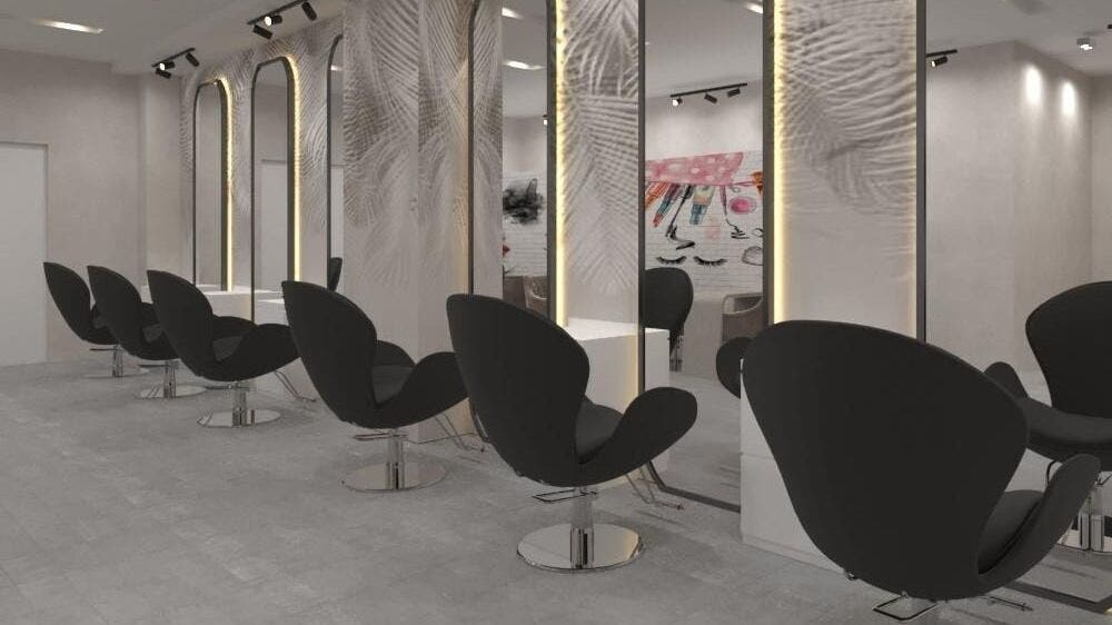 Modern salon seating at Gladys Motor City Branch, Dubai, Dubai, AE with sleek black chairs and mirrors.