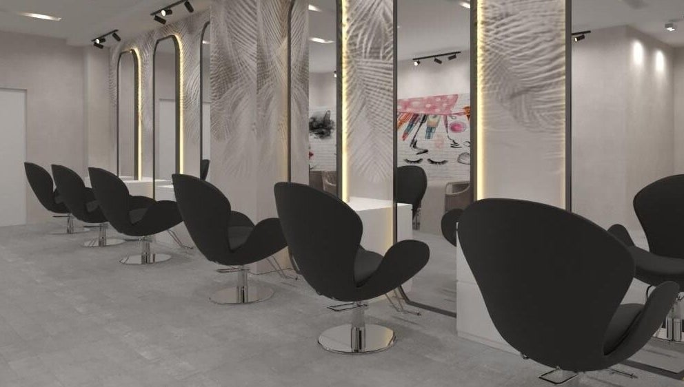 Modern salon interior at Gladys Motor City Branch, Dubai, Dubai, AE, featuring sleek black chairs and mirrors.