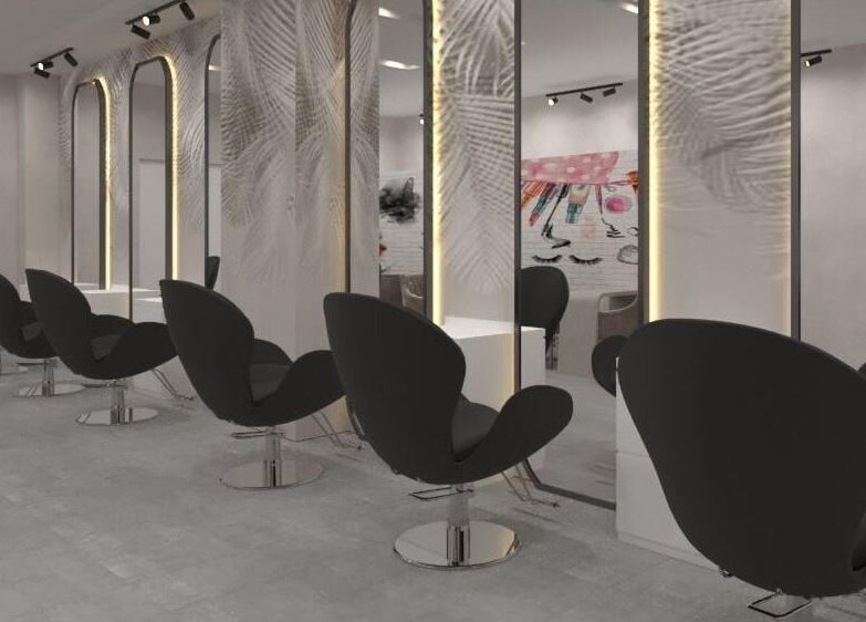 Modern salon interior at Gladys Motor City Branch, Dubai, Dubai, AE, featuring sleek black chairs and mirrors.