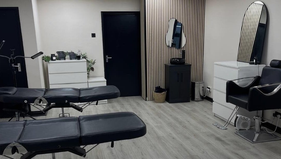 Modern beauty treatment room at INX Cosmetics, Great Wyrley, England, GB with sleek decor and stylish furnishings.