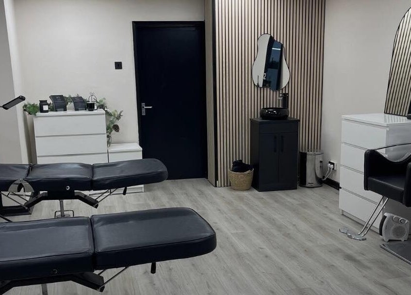 Modern beauty treatment room at INX Cosmetics, Great Wyrley, England, GB with sleek decor and stylish furnishings.