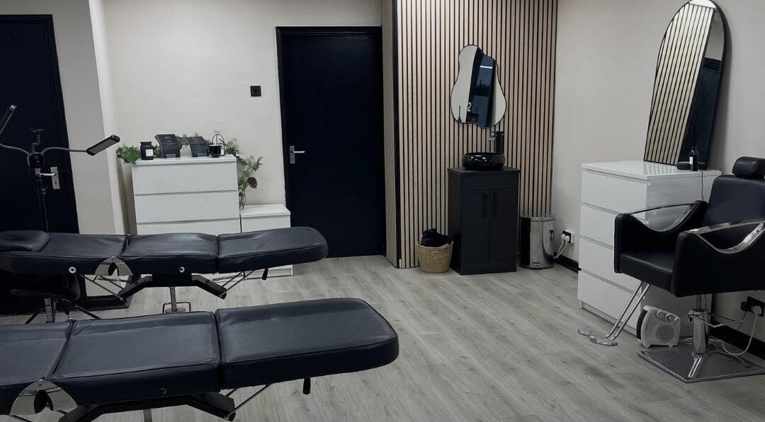Modern beauty treatment room at INX Cosmetics, Great Wyrley, England, GB with sleek decor and stylish furnishings.