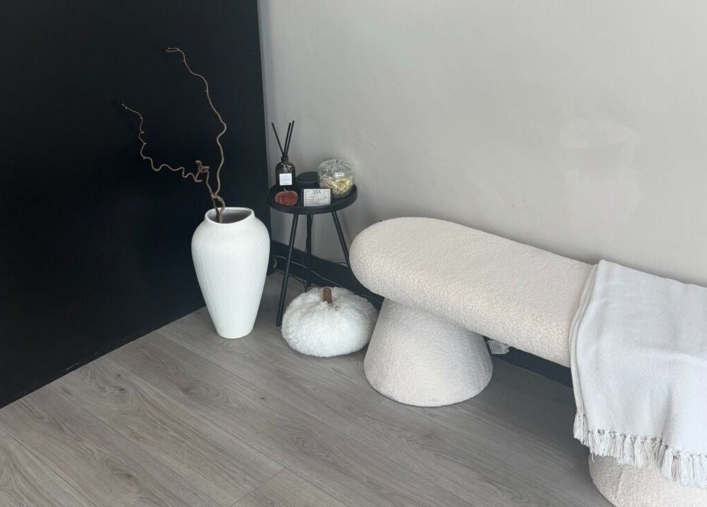 Elegant seating area at INX Cosmetics in Great Wyrley, England, GB with minimalist decor.