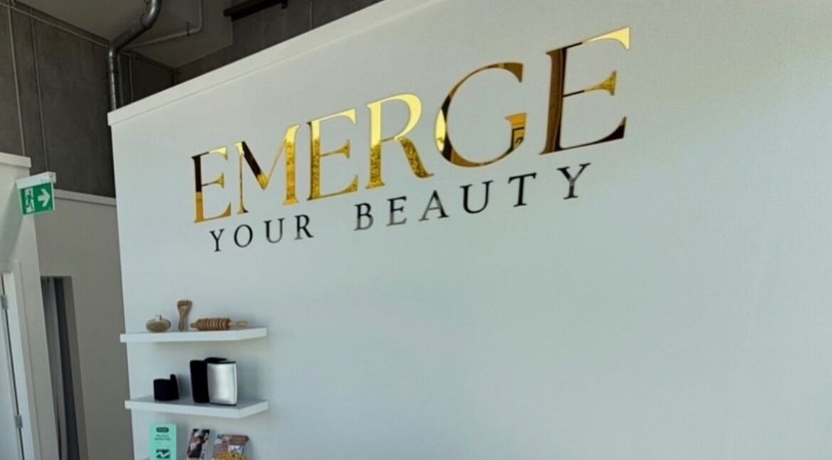 Interior wall with 'EMERGE Your Beauty' at Blink & Ink Tawa, Wellington, Wellington Region, NZ.