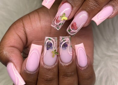 Elegant pink nails with floral and butterfly art by Nails by Pao, Lawrence, Massachusetts, US.