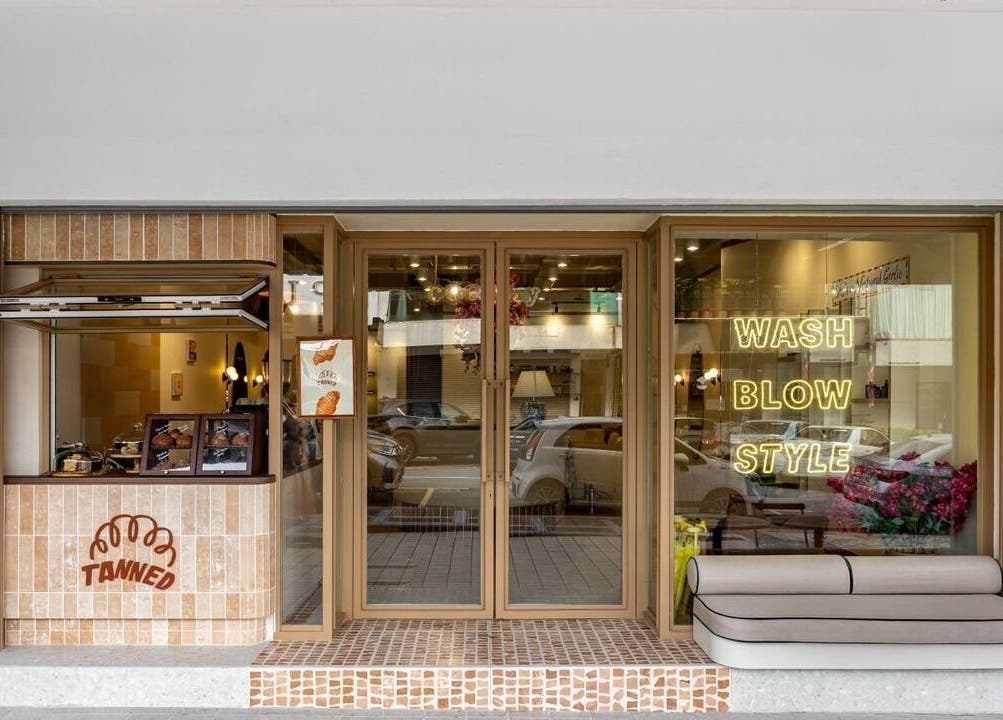 Exterior of COCOdry Bangsar in Kuala Lumpur, showcasing a stylish entrance with wash, blow, style signage.