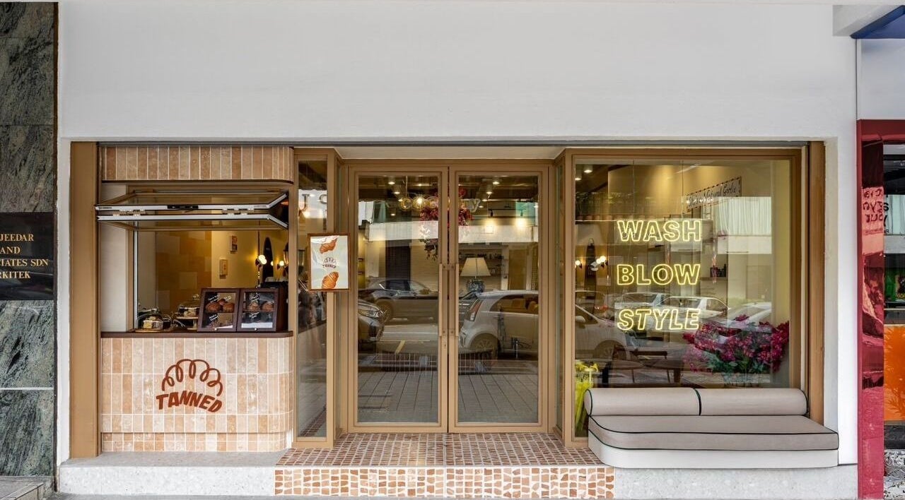 Exterior of COCOdry Bangsar in Kuala Lumpur, showcasing a stylish entrance with wash, blow, style signage.