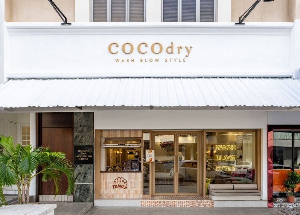 Front view of COCOdry Bangsar, Kuala Lumpur, showcasing its inviting entrance and stylish design.