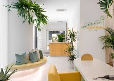 Stylish interior of COCOdry KLCC in Kuala Lumpur, featuring lush plants and modern decor. Ideal beauty and wellness space.