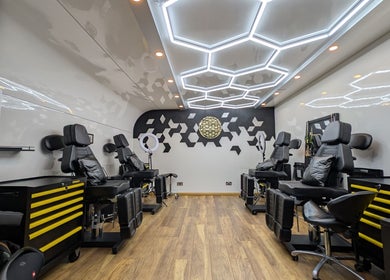 Chic interior of Organic Joy Tattoo in Dublin, County Dublin, IE with modern decor and tattoo chairs.