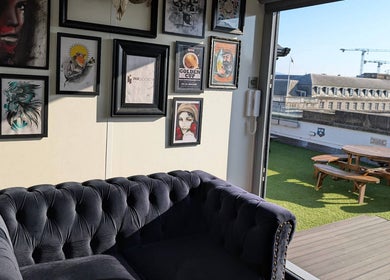 Cozy corner at Organic Joy Tattoo with framed art and terrace view in Dublin, County Dublin, IE.