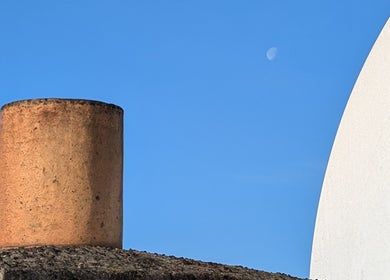 View of rustic chimneys under clear blue sky near Organic Joy Tattoo, Dublin, County Dublin, IE.