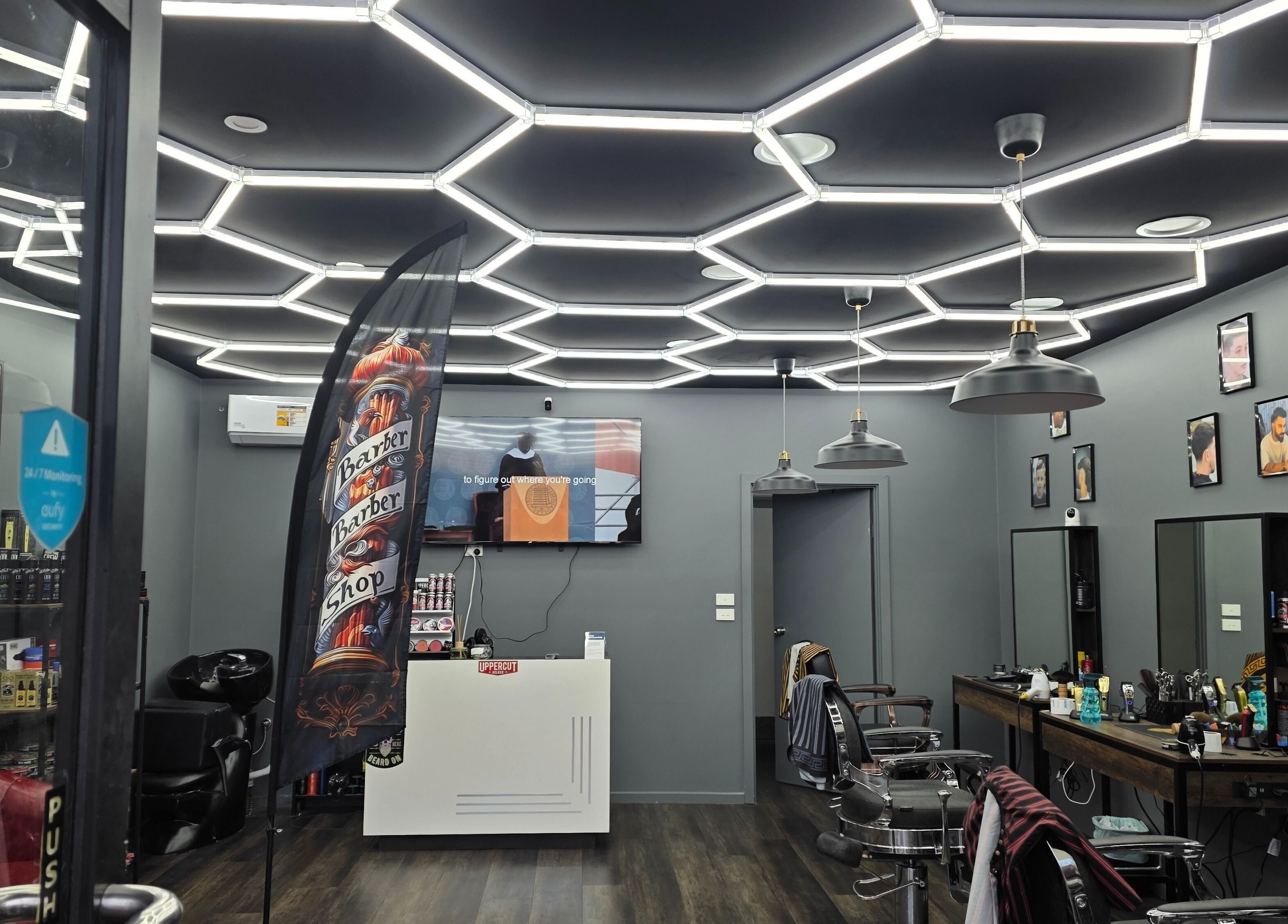 Modern barber shop interior at 4/22 Jardine Street Kingston, featuring stylish lighting and setup, Kingston, AU.