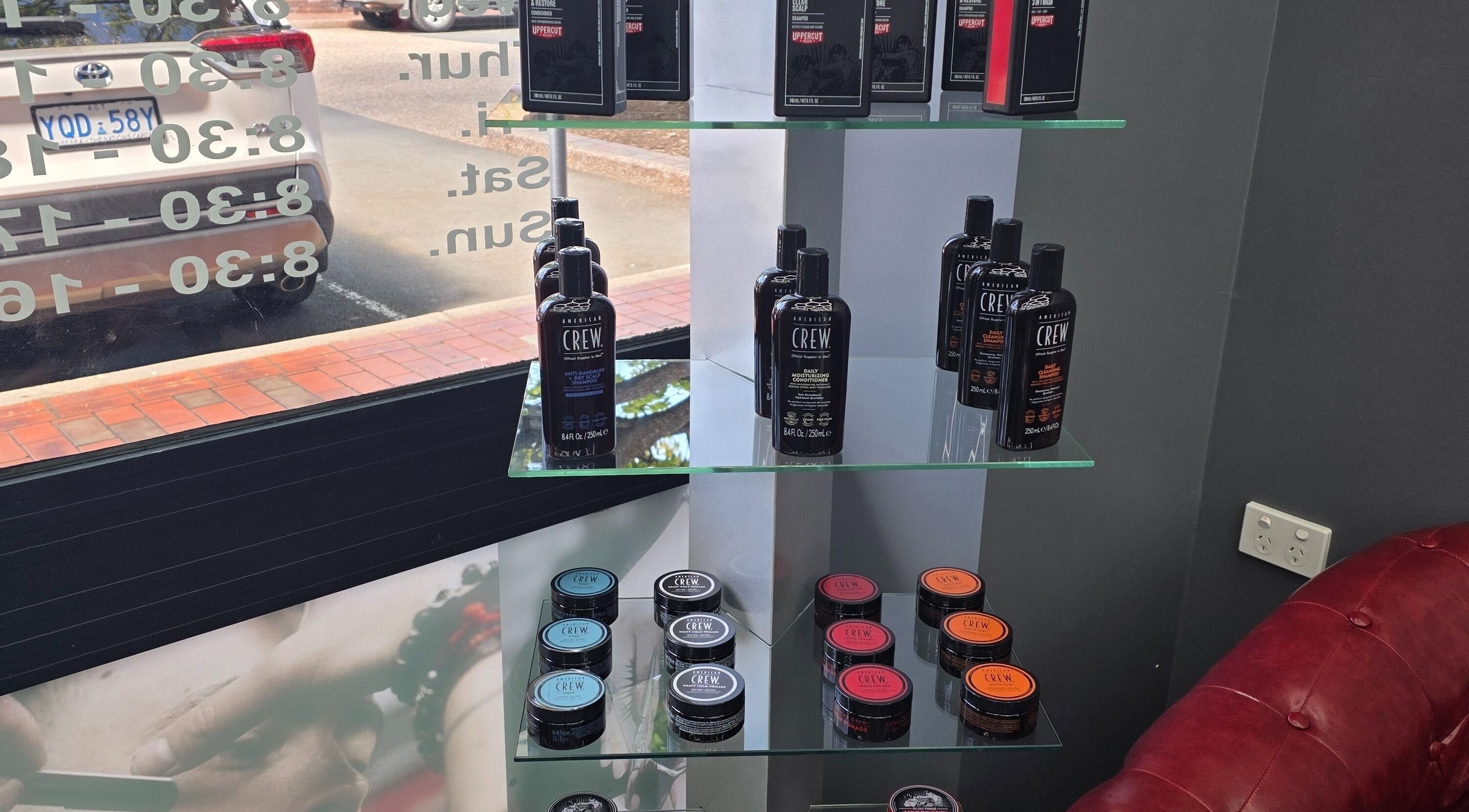 Hair care products displayed on glass shelves at 4/22 Jardine Street Kingston, Australian Capital Territory, AU.